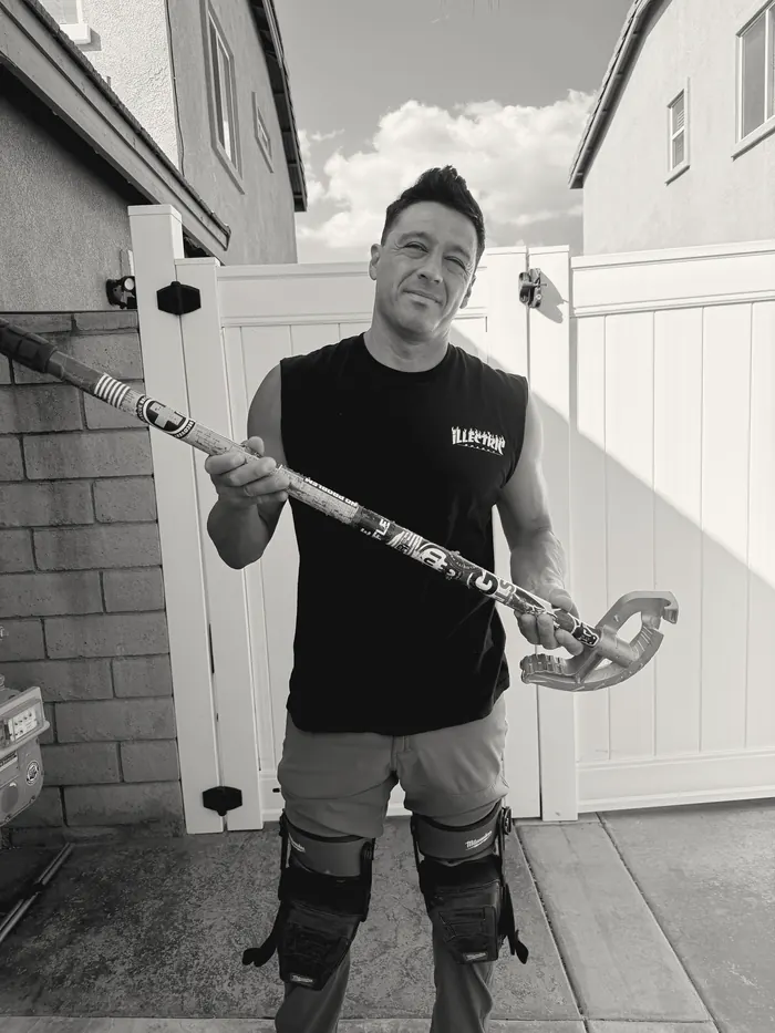 Joe Ramirez, California licensed C-10 electrical contractor, holding a conduit bender